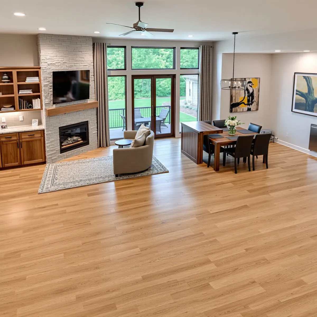 Renovated modern living room in Oliver Springs, TN, with hardwood floors, neutral furniture, large windows, and sleek open-concept design.