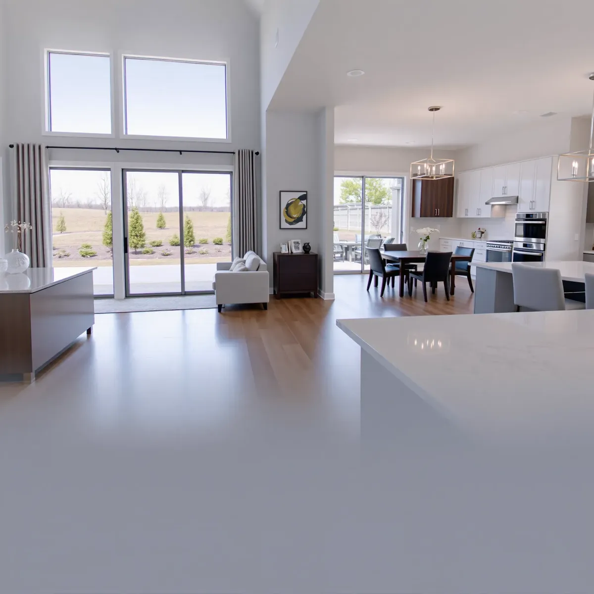 Modern renovated Halls Crossroads home interior featuring open living space, hardwood floors, quartz countertops, and natural light.