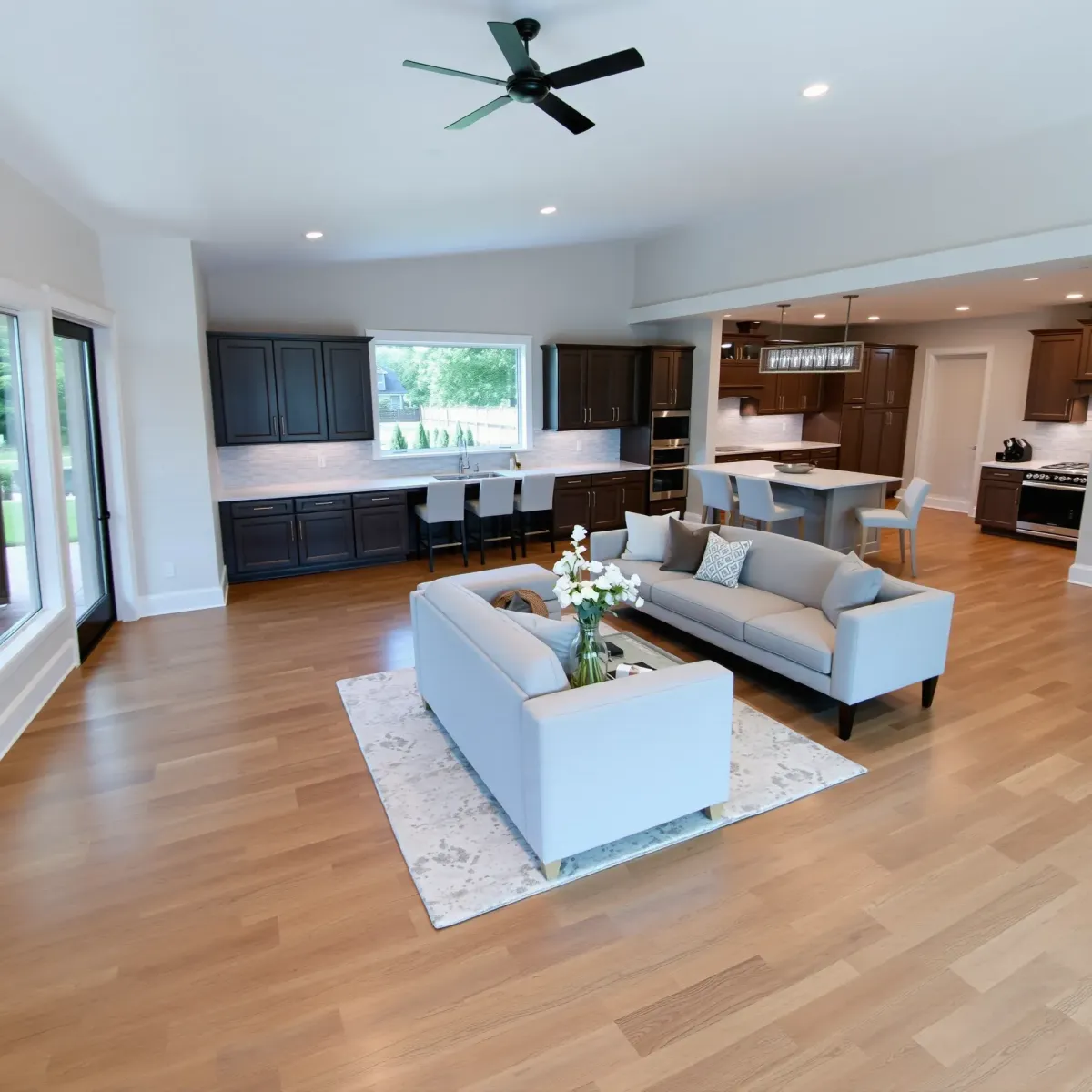 Remodeled Athens, TN home interior with modern finishes, open living area, stylish kitchen, plush sitting space, and lush outdoor view.