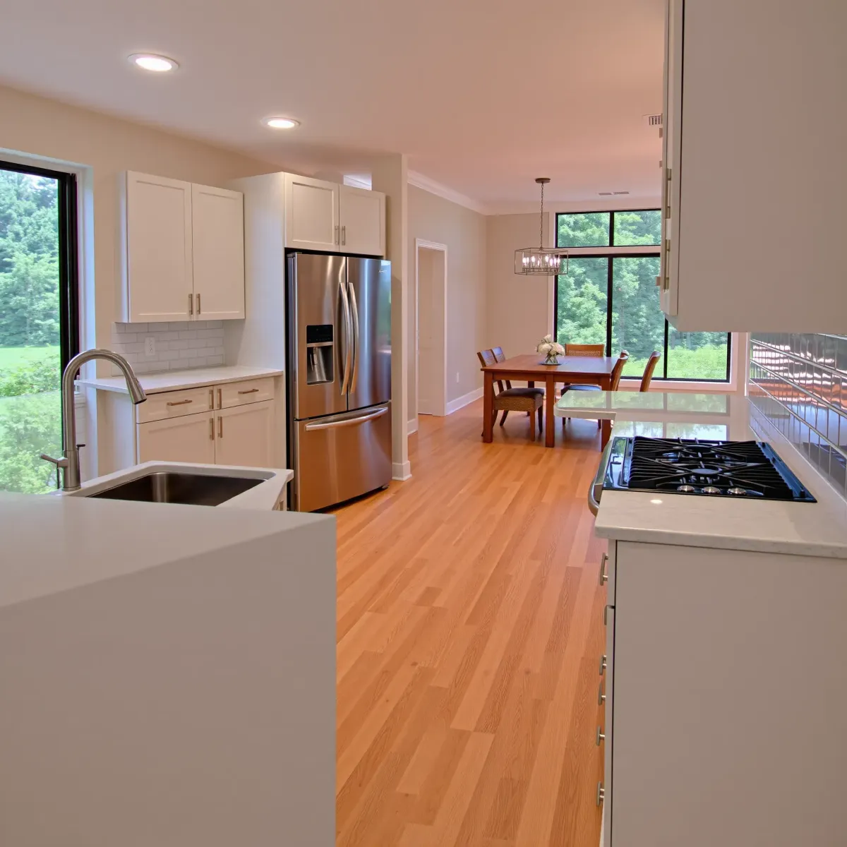 Complete Greeneville, TN kitchen remodel with modern wood cabinetry, granite countertops, stainless steel appliances, and scenic views.