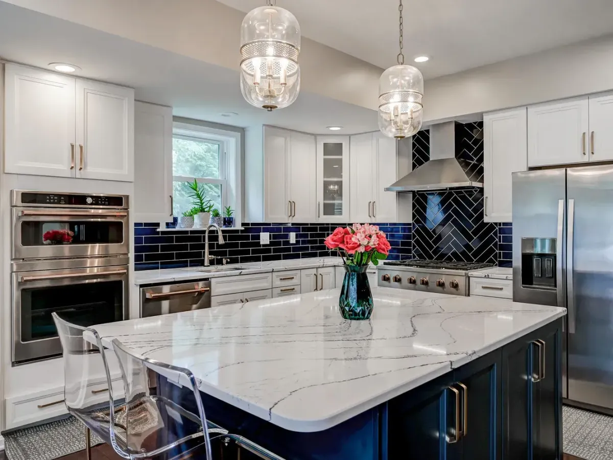 Remodeled Knoxville kitchen with granite countertops, stainless appliances, custom cabinetry, hardwood floors, and natural light.