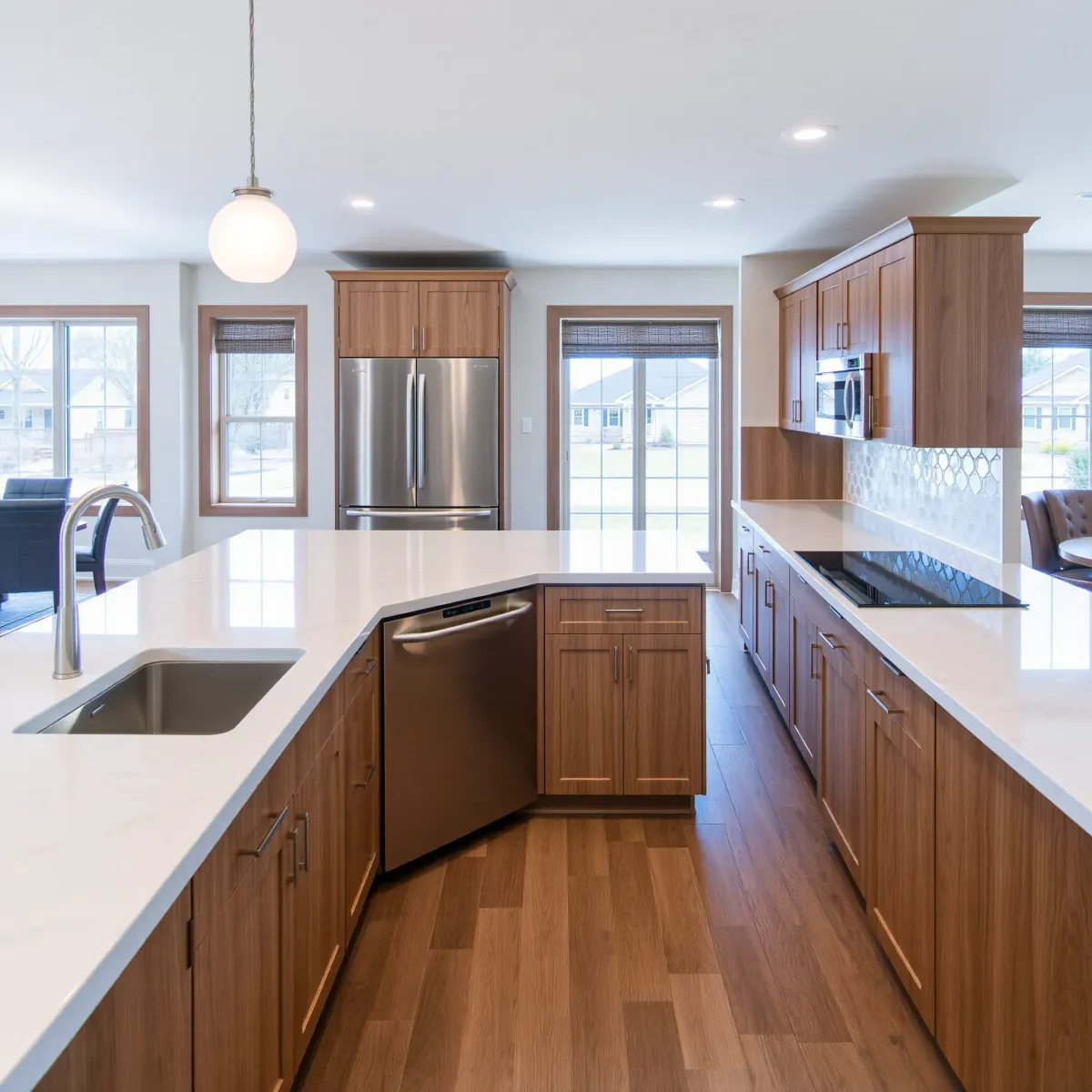 Renovated Johnson City kitchen with quartz countertops, stainless steel appliances, wooden cabinets, and natural light.