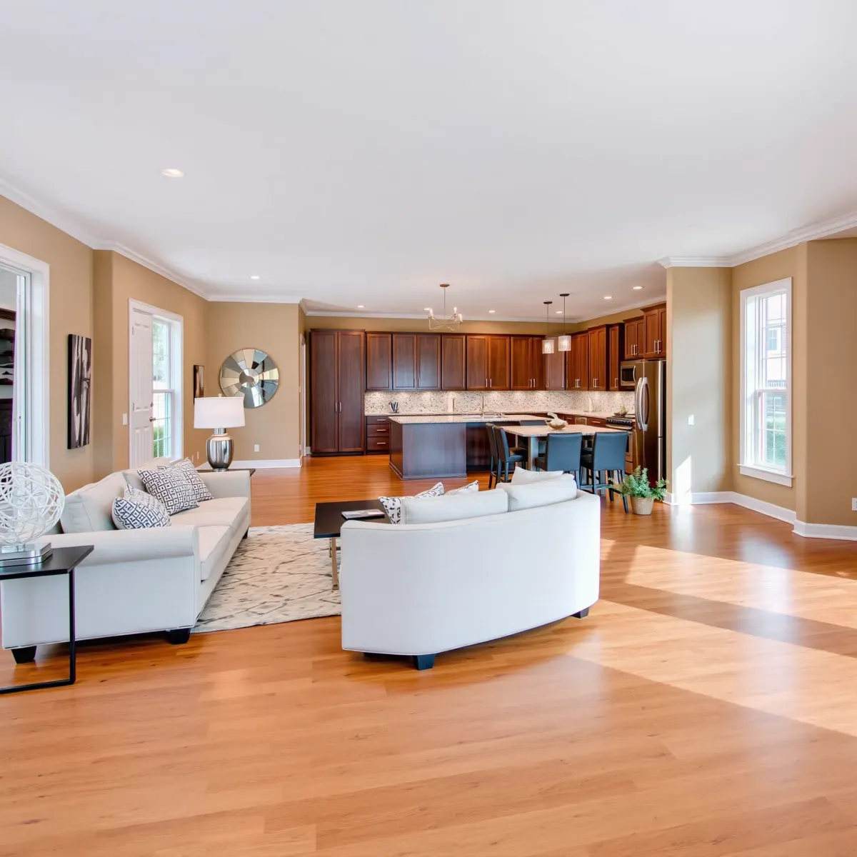 Remodeled Knoxville home interior featuring a modern living room, hardwood floors, open-concept kitchen, and stylish decor.