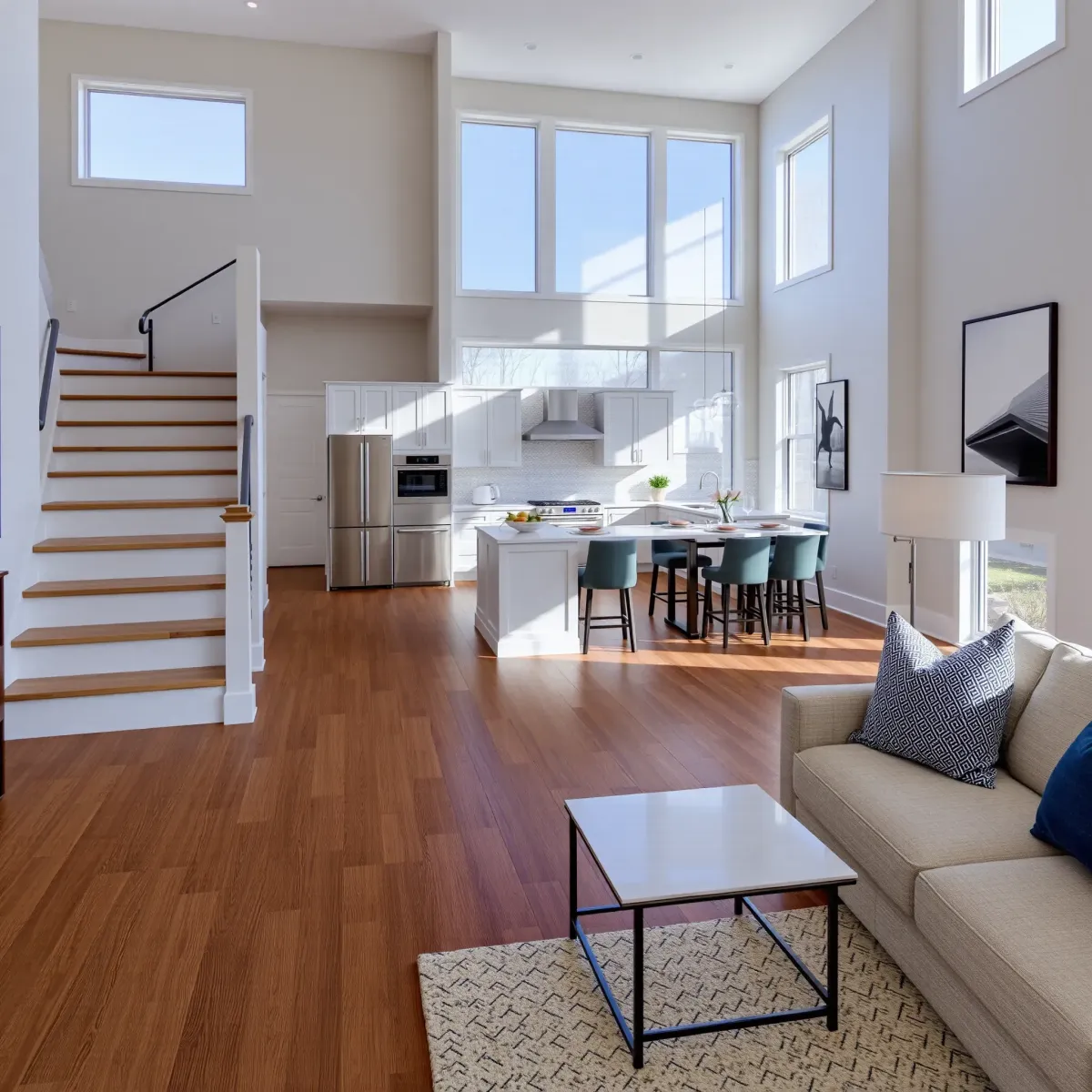 Remodeled Alcoa, TN home interior with modern open living space, sleek hardwood floors, contemporary furniture, and stylish kitchen.