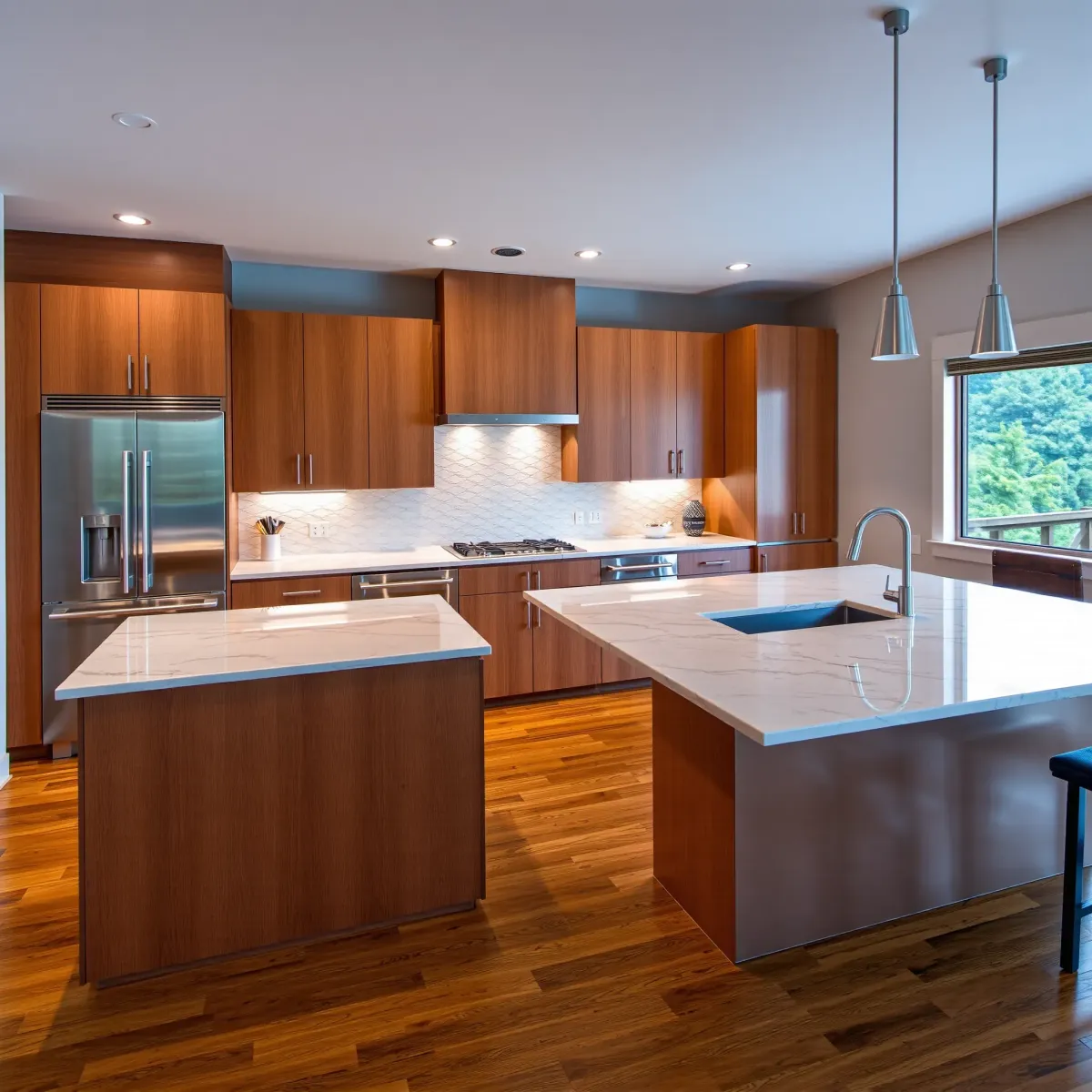 Completed Pigeon Forge kitchen with granite counters, stainless steel appliances, wooden cabinets, and mountain views.