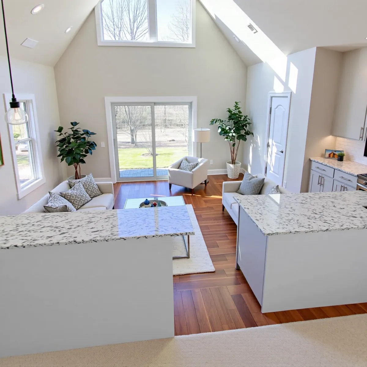 Modern home in Alcoa, TN with renovated living room and kitchen featuring sleek design, high-end finishes, and natural light.