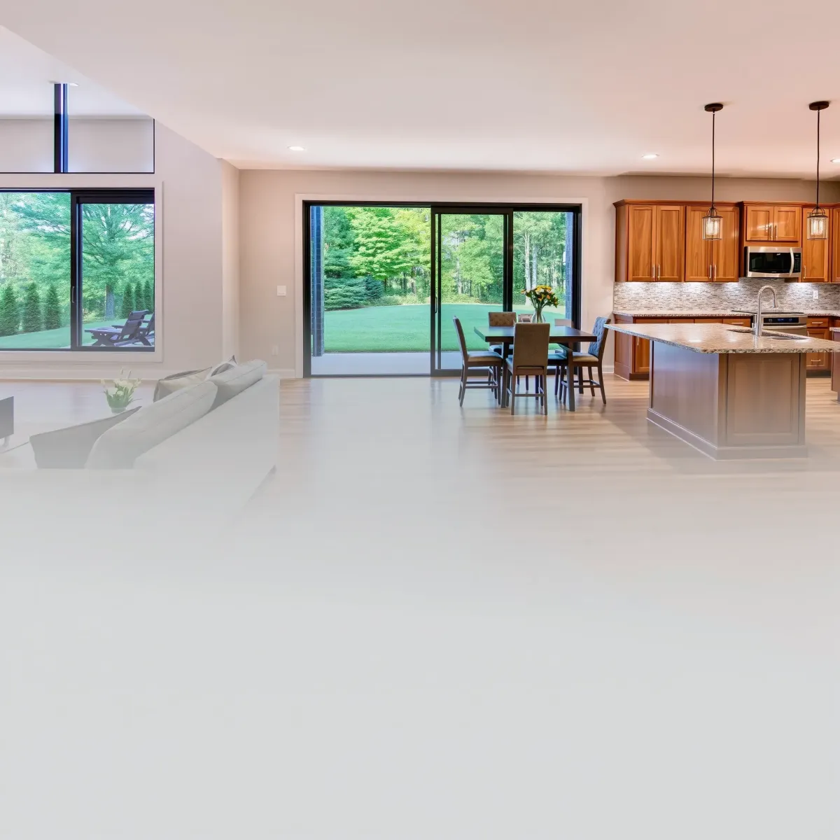 Beautiful remodeled Oliver Springs home interior with modern living room, stone fireplace, large windows, and elegant kitchen.