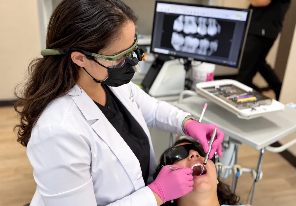 Dr. Deven Allert reviewing high-resolution dental radiographs and treatment options collaboratively with a patient