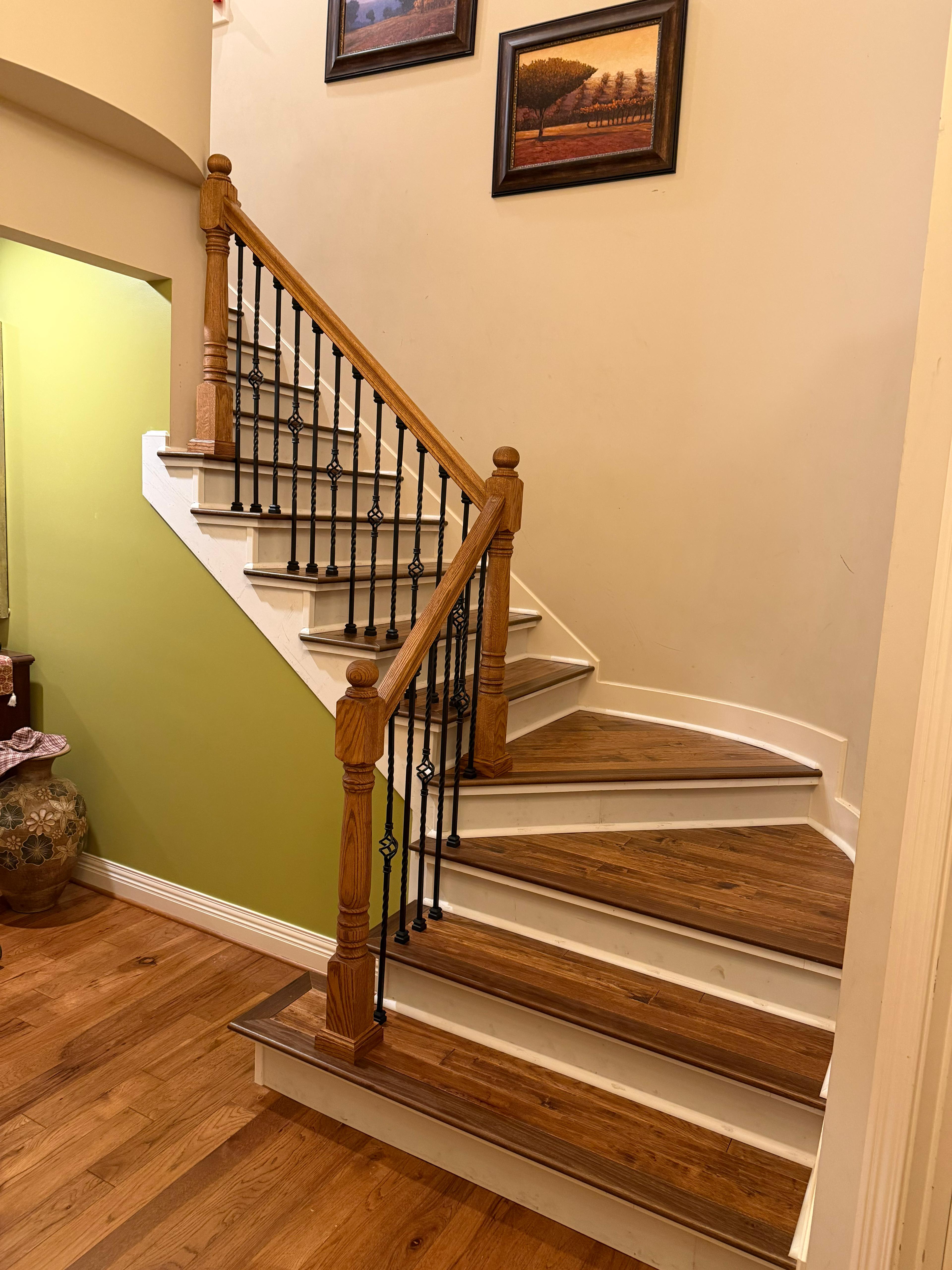 New balusters, handrail, stairs and paint to refresh entry of Mill Creek home