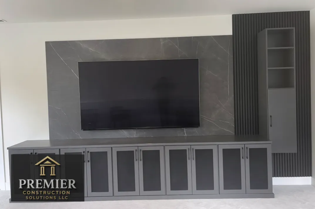 Basement remodel with upgraded entertainment system storage with accent wall for a family in Issaquah, WA