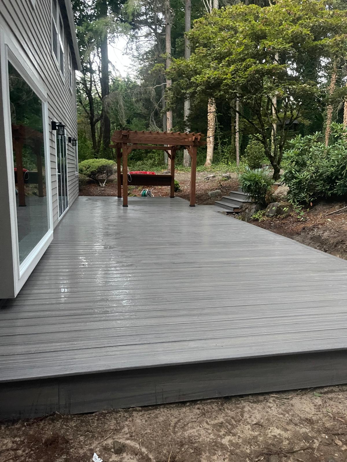 New ground level Trex deck and stairs with custom small pergola for our clients in Bridle Trails area near Kirkland, WA