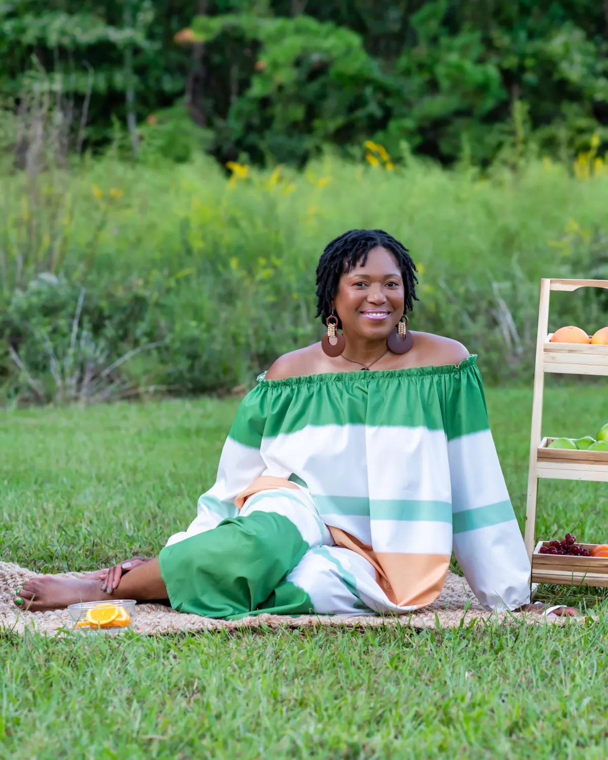 Kerie-Ann Lawrence, Nurse Practitioner and holistic wellness coach, smiling warmly outdoors