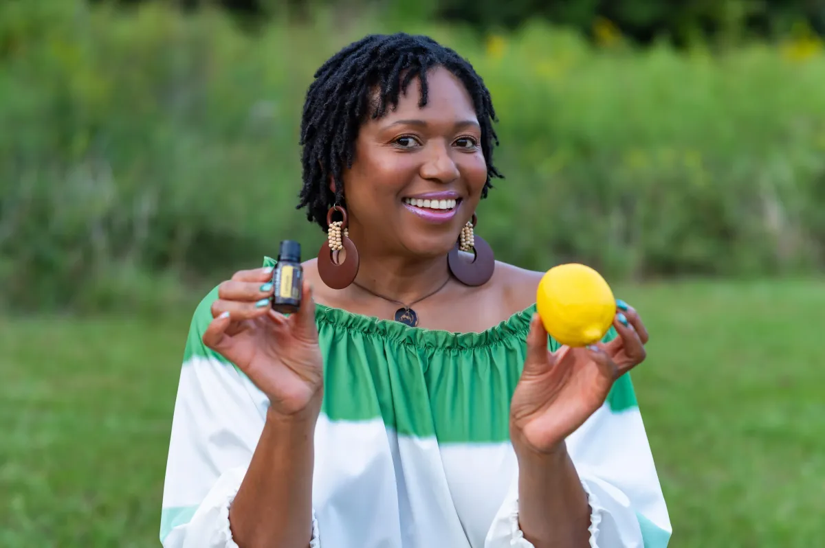Woman showing natural cleaning products