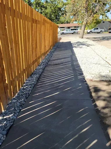 Howard and Family team installing durable fencing for backyard security