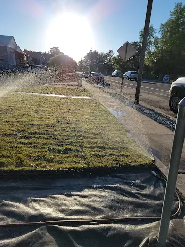 Howard & Family Lawn Services installing efficient sprinkler system in West Valley City lawn