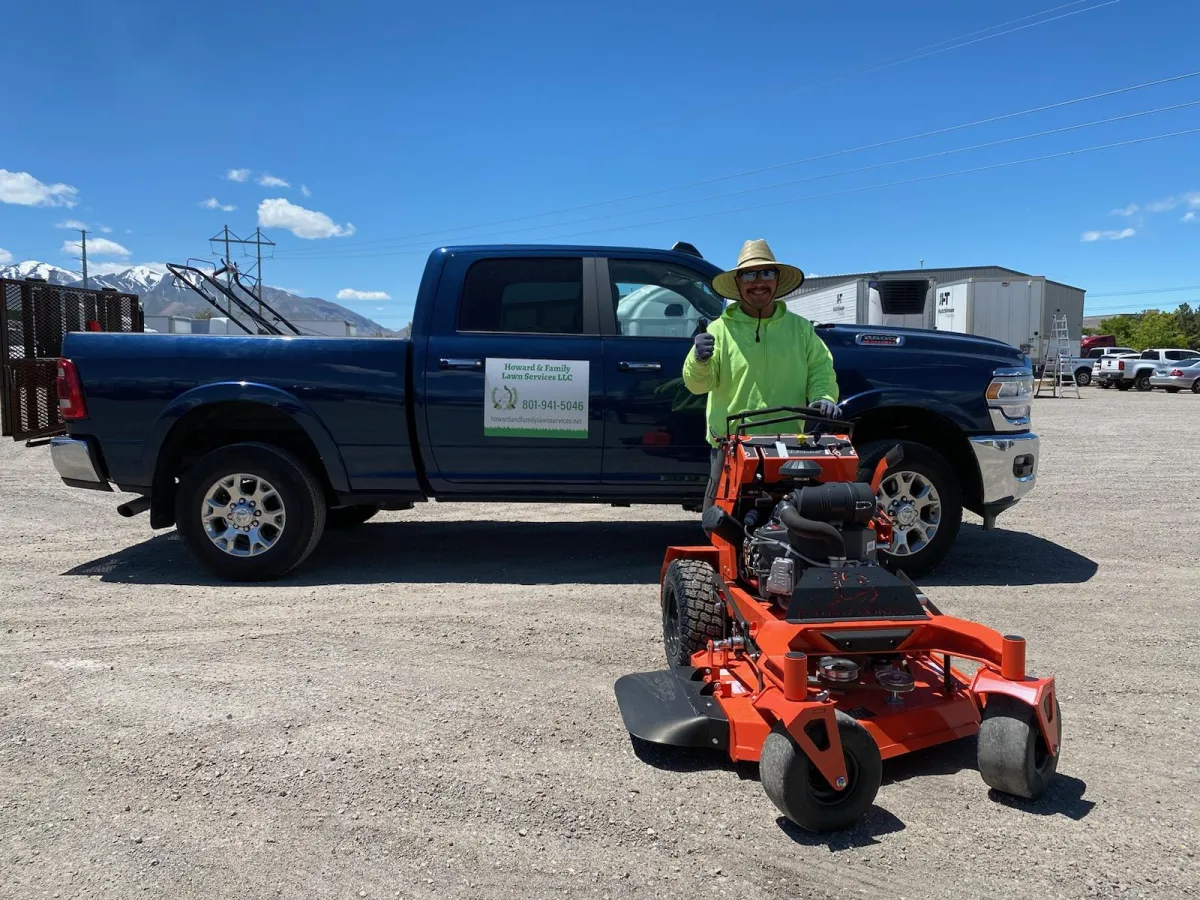 Howard and Family team mowing grass with commercial mower