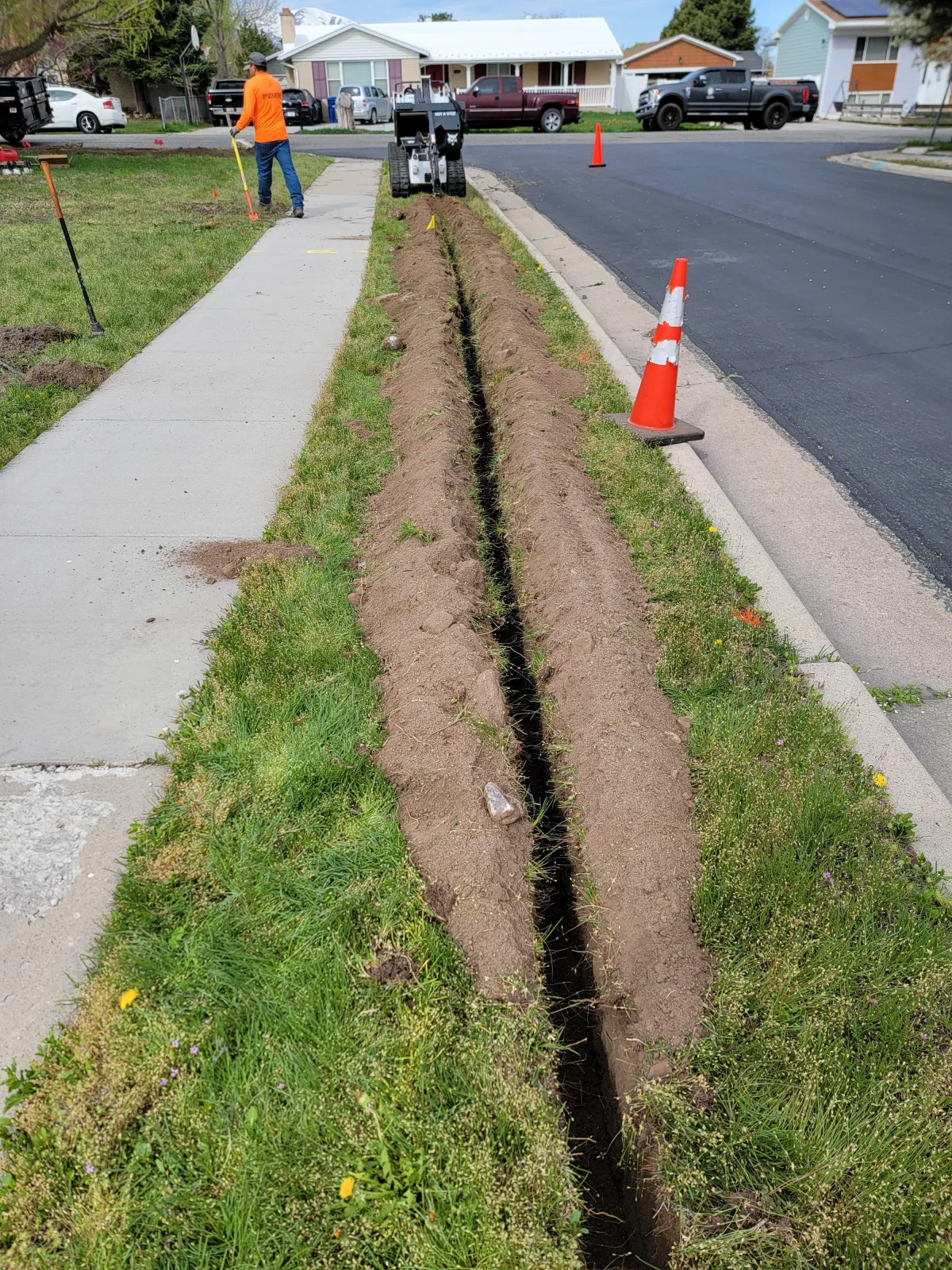 Automatic sprinkler system watering freshly sodded lawn