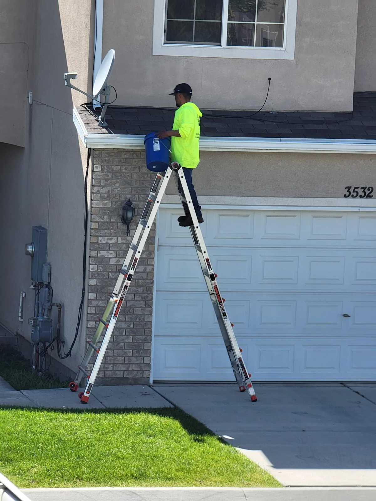 Crew collecting and bagging leaves from Utah lawn
