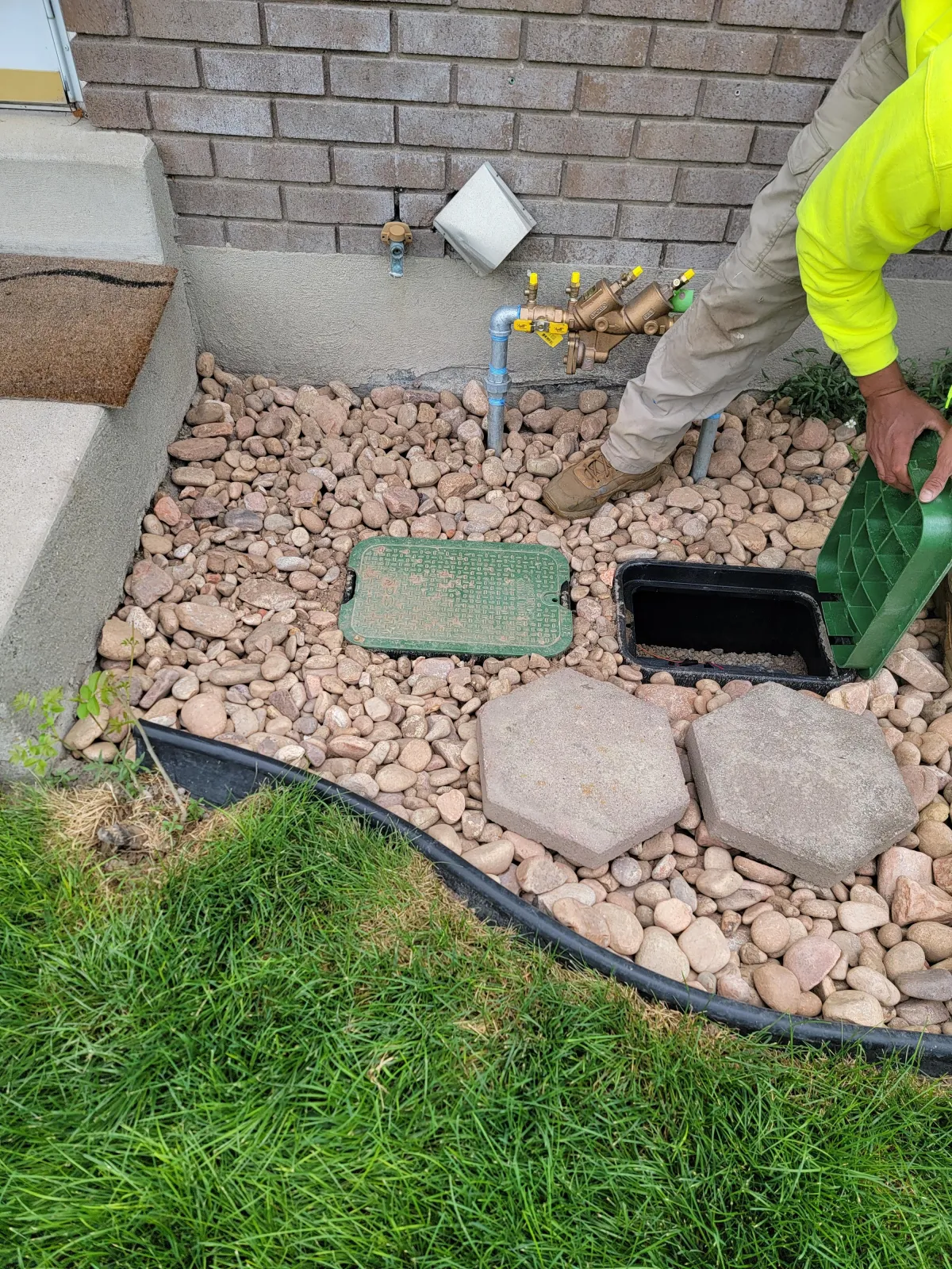 Automatic sprinkler system watering freshly sodded lawn