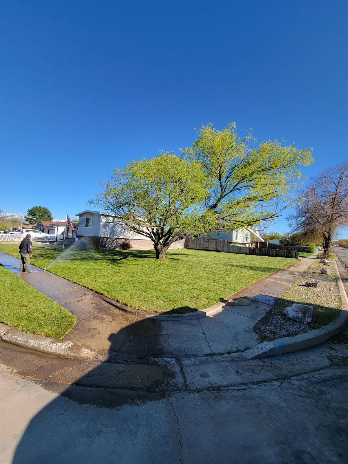 Professional irrigation system setup by Howard & Family Lawn Services for water-saving lawn care in Utah