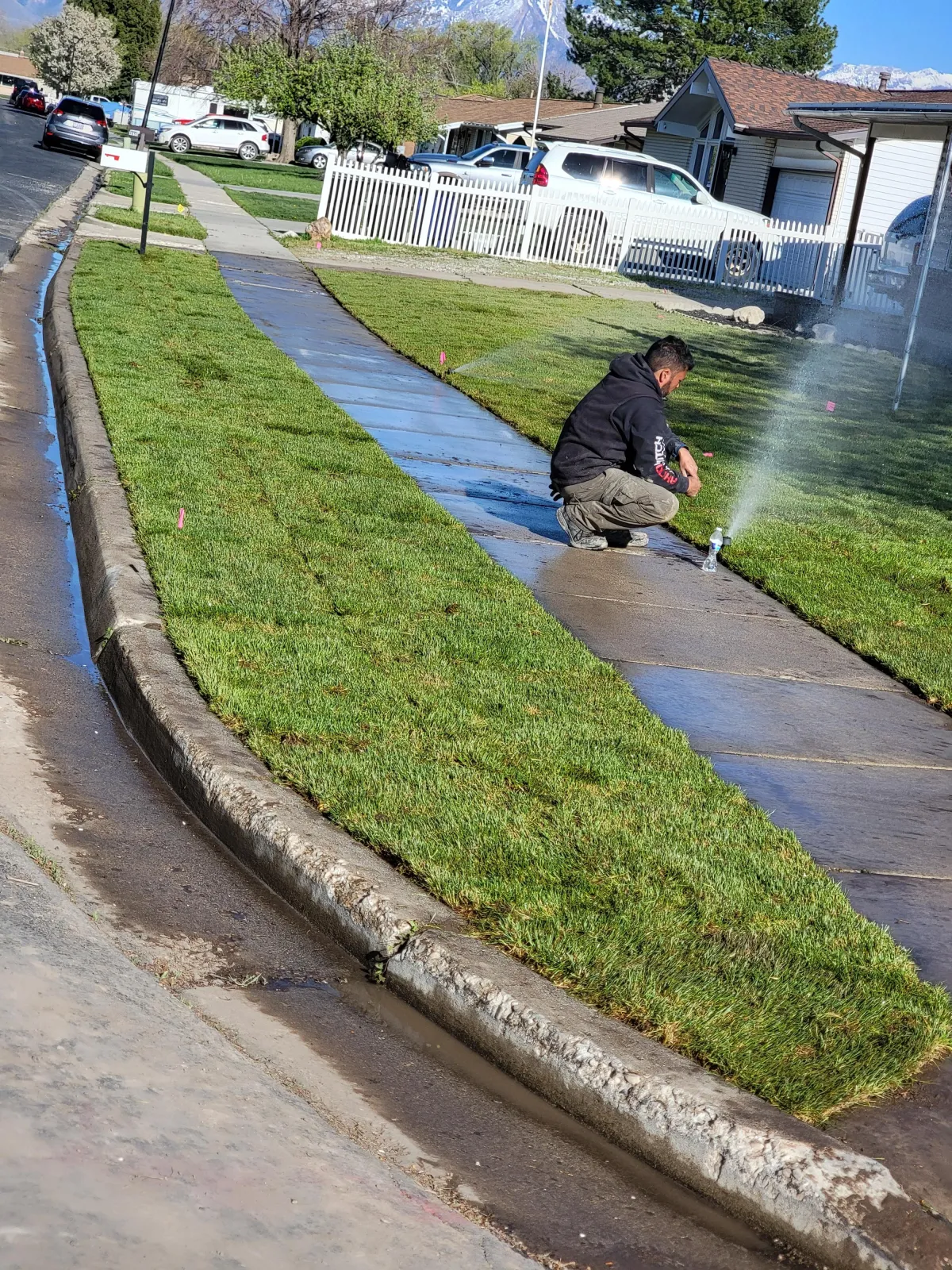 Howard & Family Lawn Services installing efficient sprinkler system in West Valley City lawn
