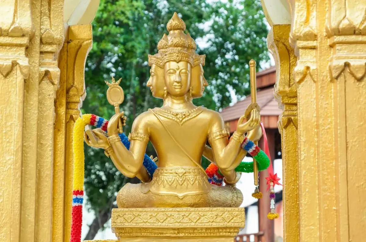 golden four face Buddha statue in Thailand