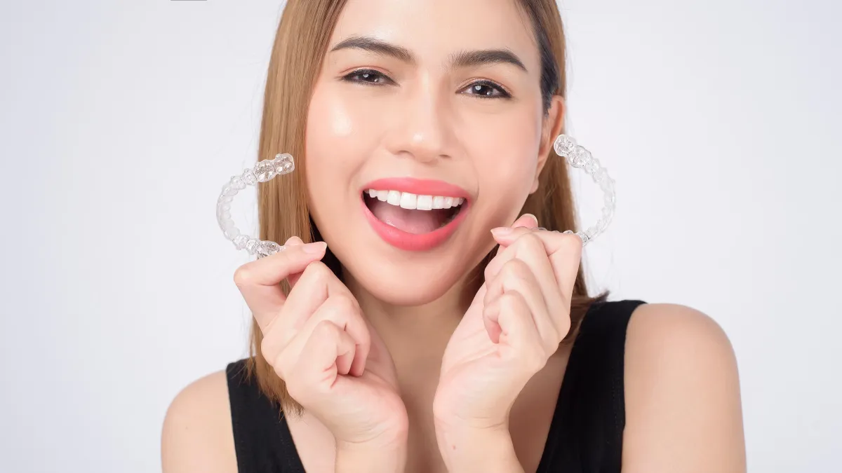 person with silver teeth braces
