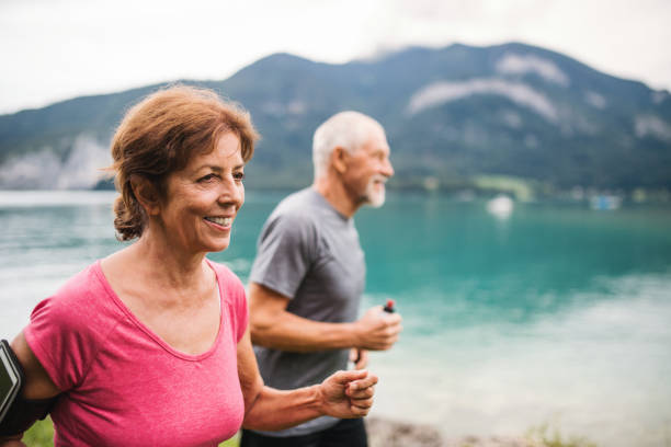Elderly couple running outdoors