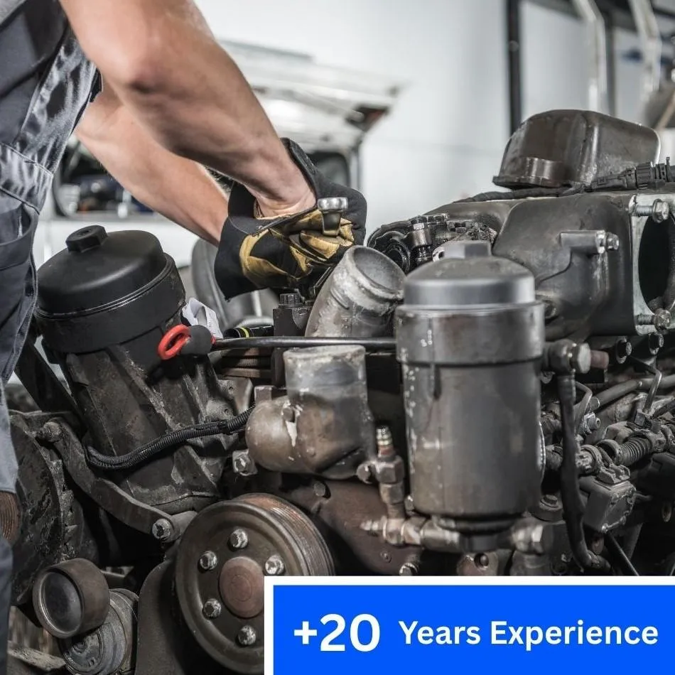 Experienced auto mechanic repairing diesel car engine