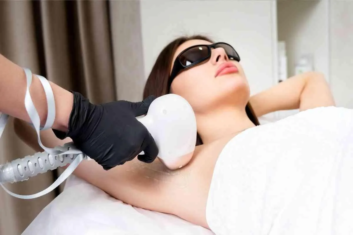 person about to touch the calm water