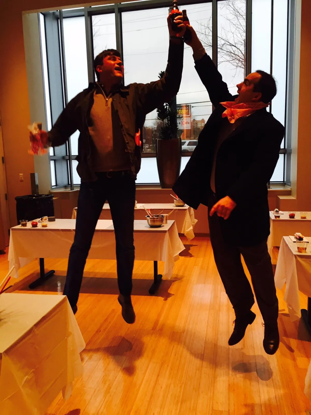 Jumping High Five at a Team Building Event