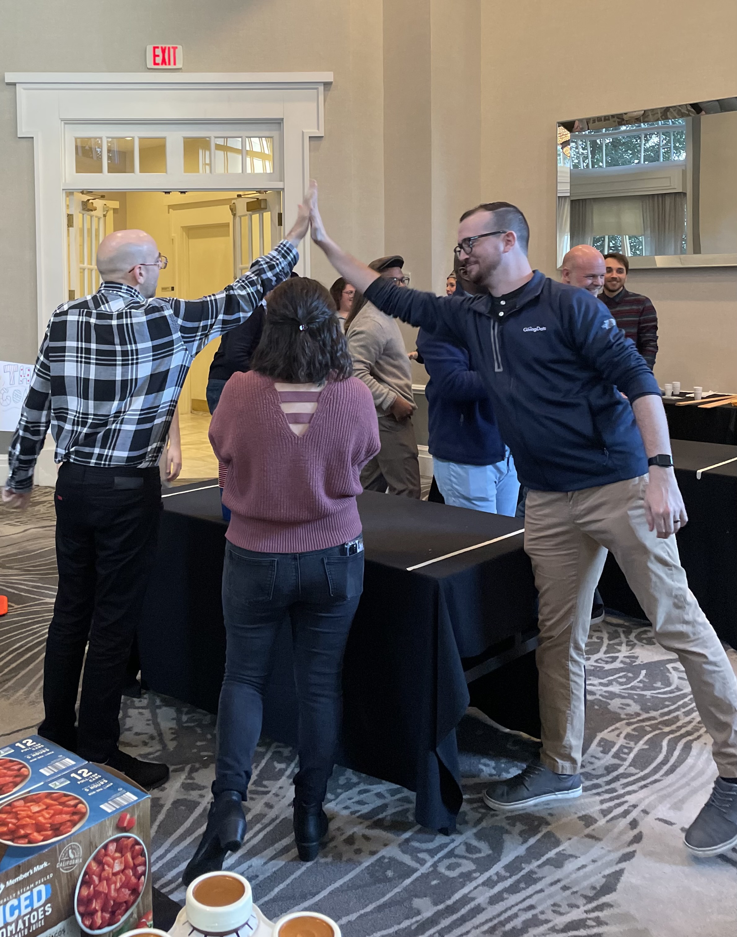 Small Group of Corporate participants doing a high five