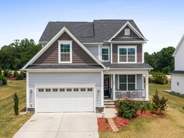 Two-story family home with attached garage and front porch