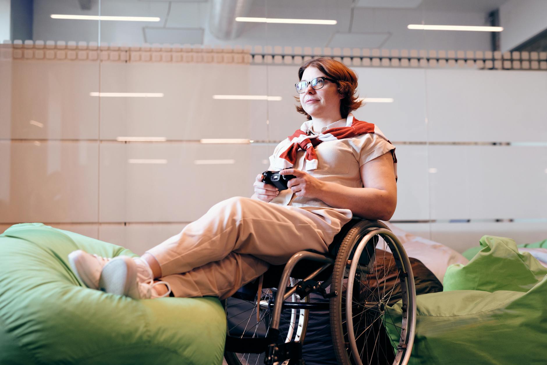 a person sitting on a chair with a foot in a cast