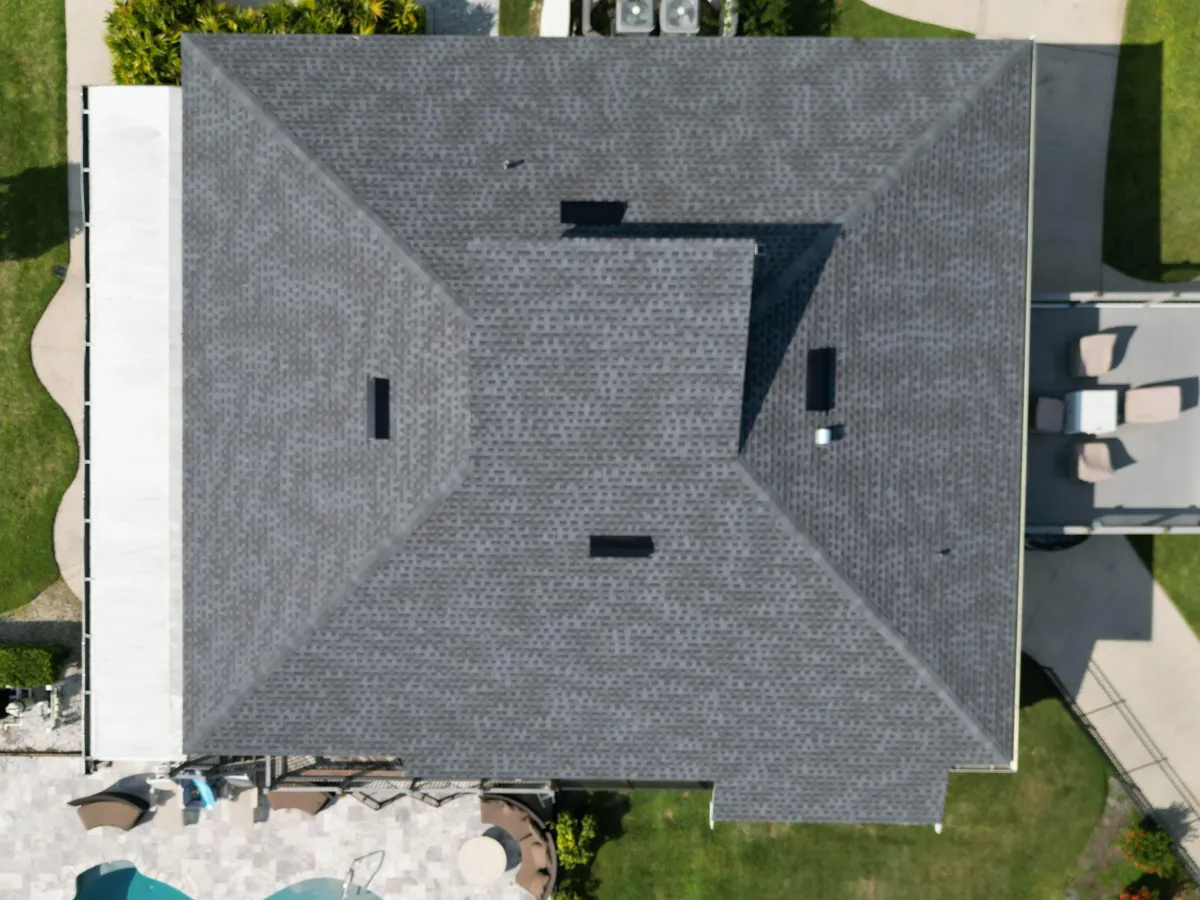 Architectural asphalt shingle roof installation on a luxury home with complex rooflines and multiple gables by GMS Roofing and Construction LLC.