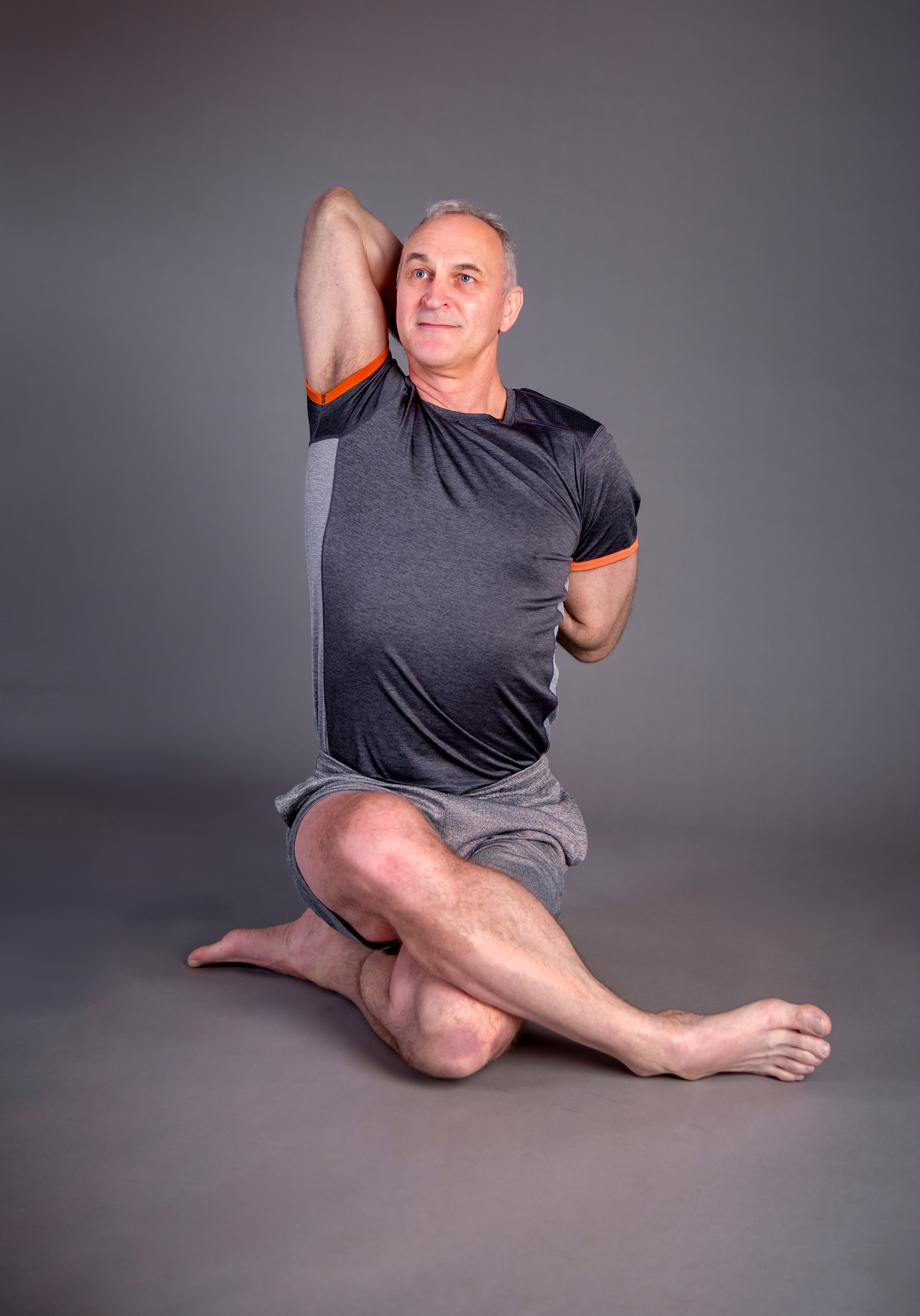 Yoga instructor assisting a student