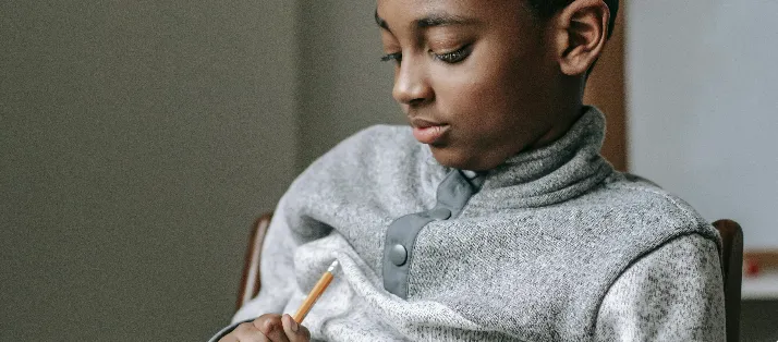 Child learning coping strategies and building resilience while managing school challenges and homework.