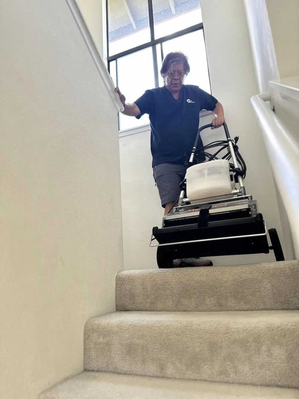bringing down the arpet cleaning machine from the top floor