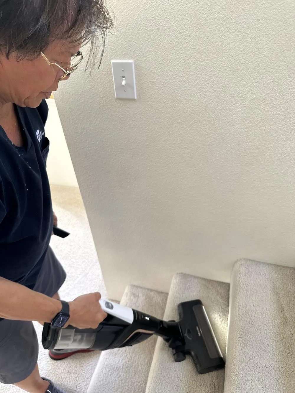 vacuuming carpeted staircase