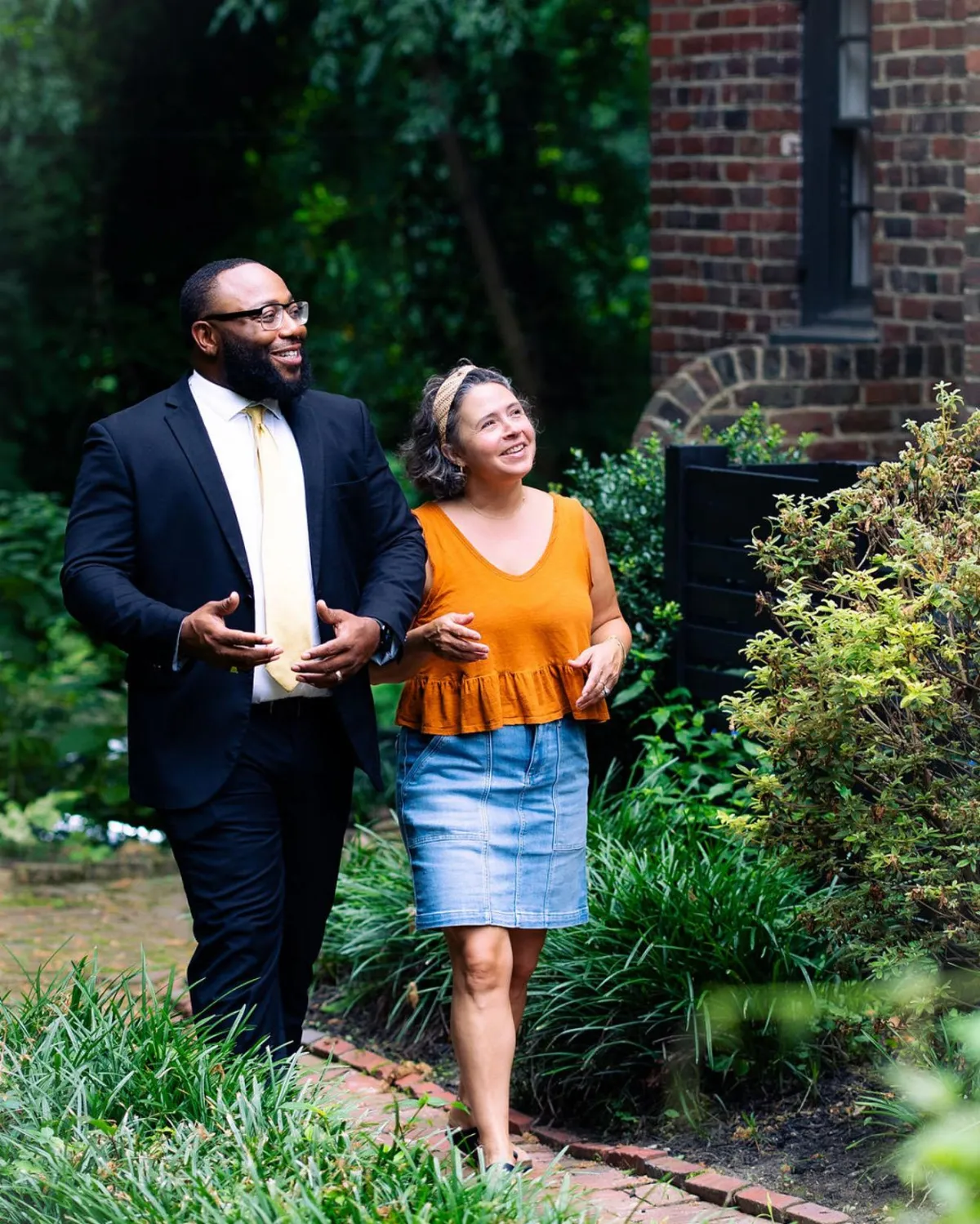 person covered in white blanket while laying on bed