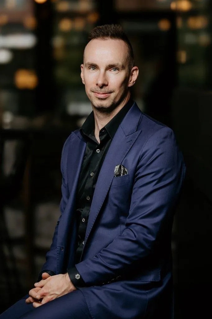 Derek Burbidge of Cardero Clothing in a navy suit with peak lapels and a black dress shirt.