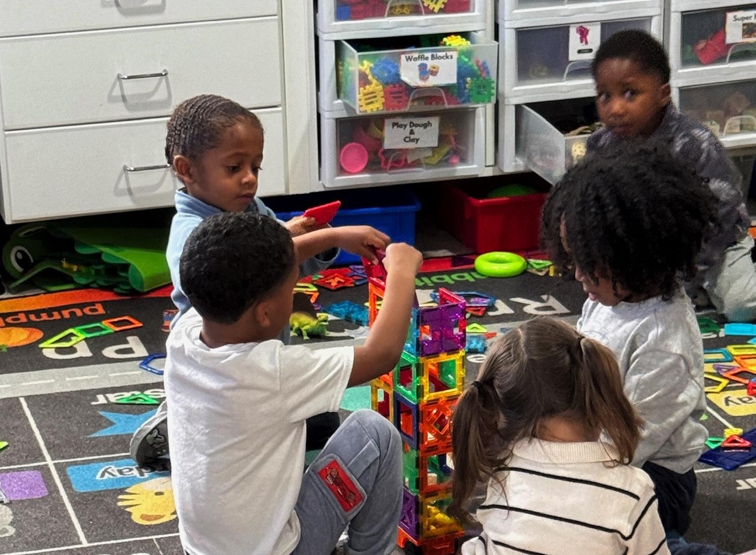 Girl watches a lesson about the alphabet on a laptop