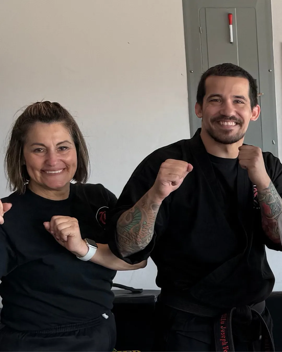Sifu Joseph and Adult Student smiling at camera.