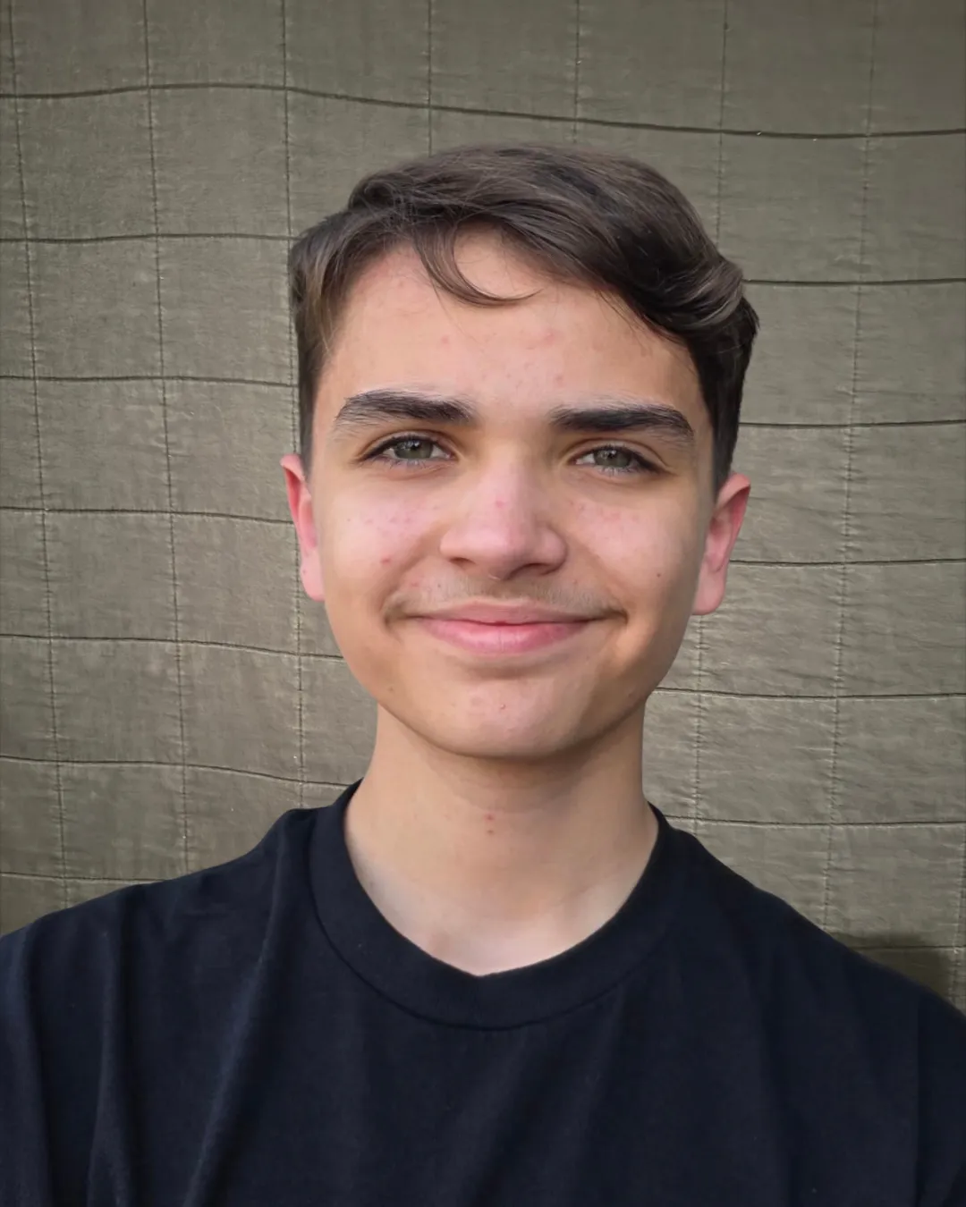 Teen student smiling to camera.