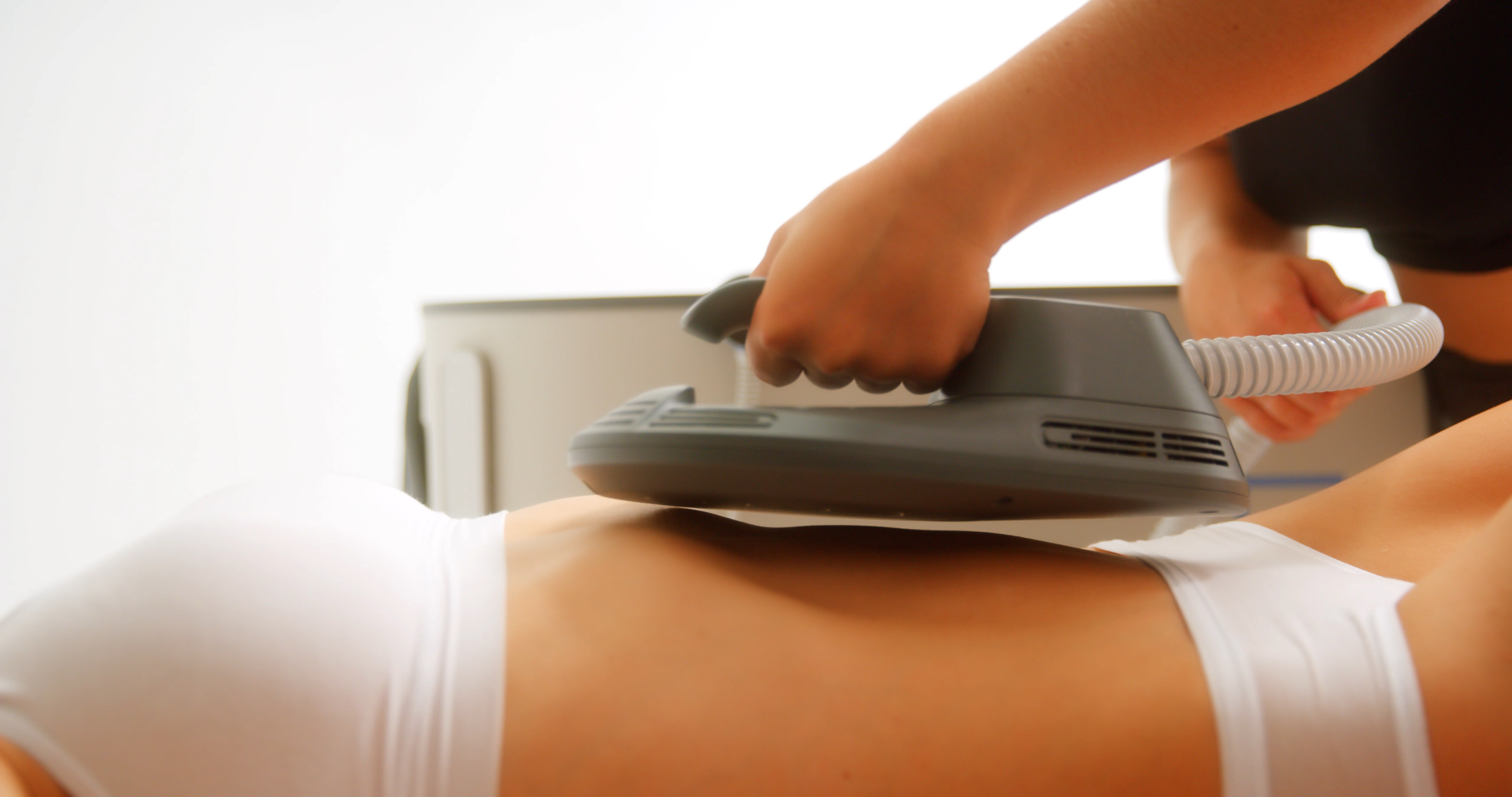 Emsculpt NEO abdominal appliance placed on model