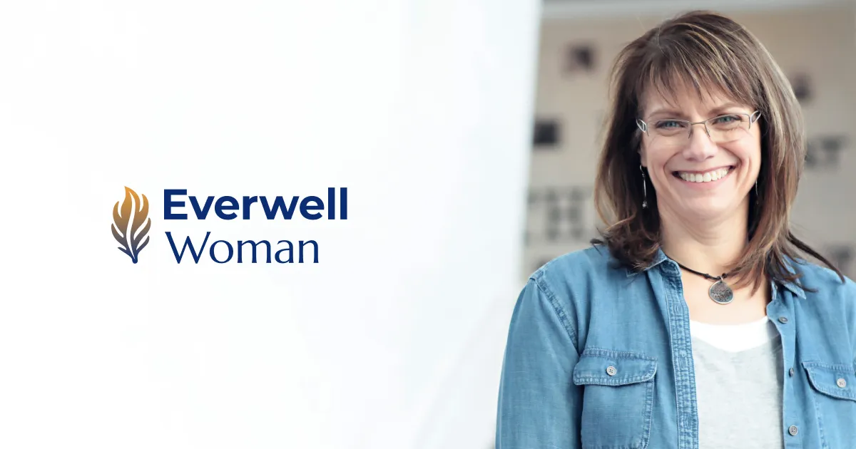 Dr. Terri Peña smiling beside the Everwell Woman logomark