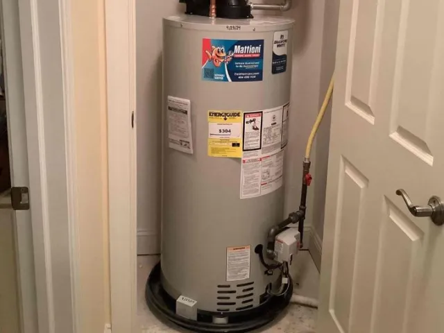 Residential water heater installed in a utility closet in Bloomfield Hills