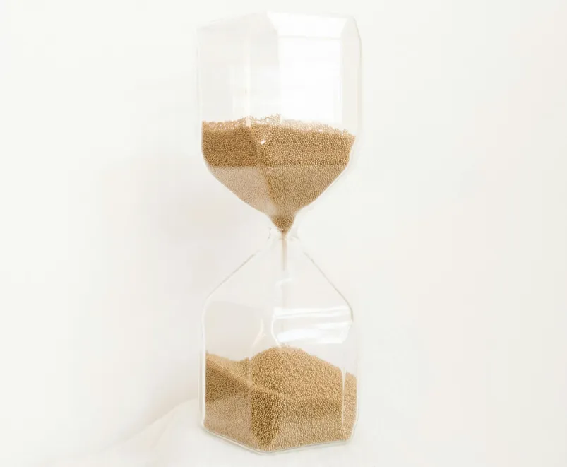 gray and black stone near body of water during daytime