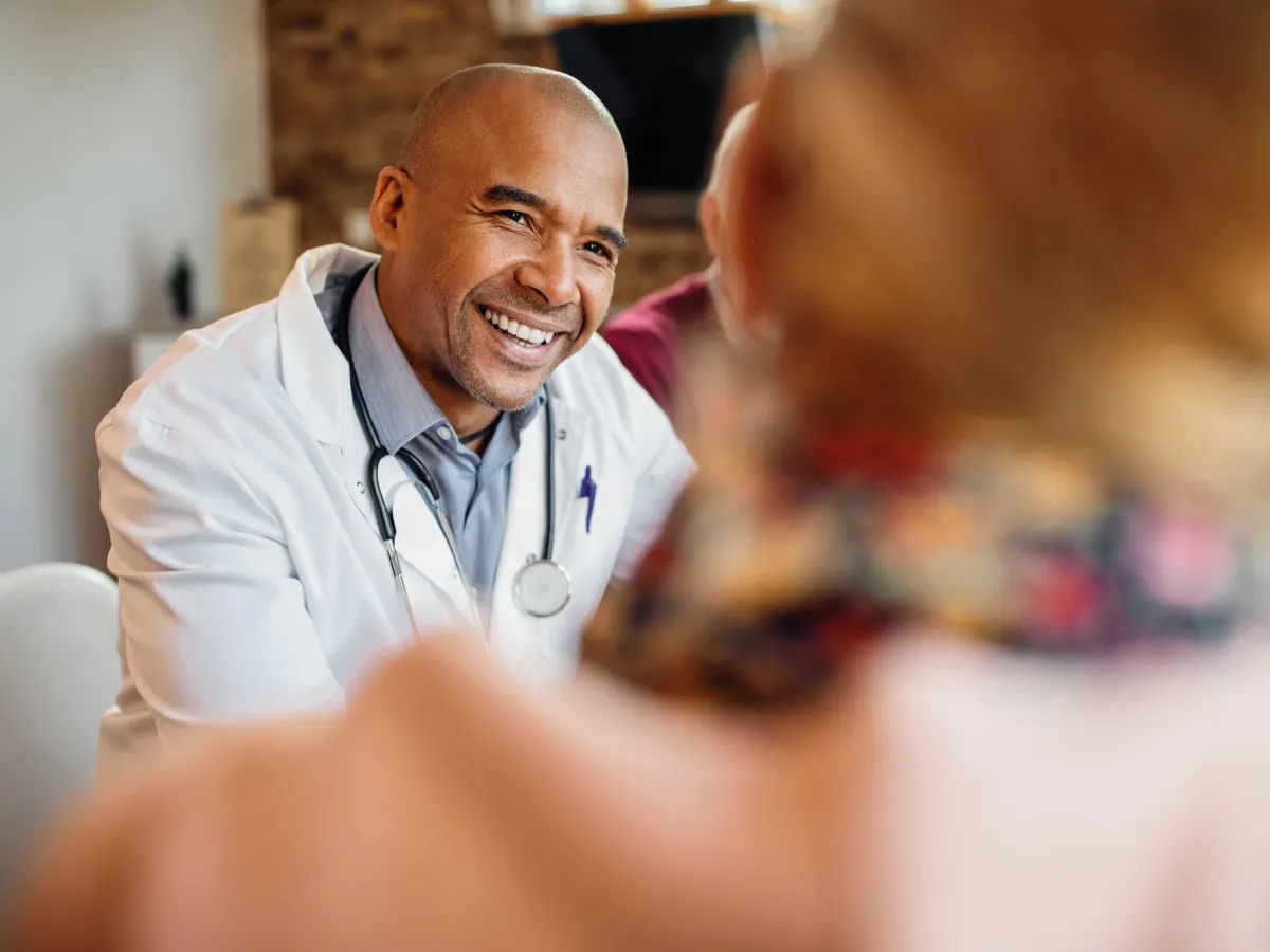 Doctor smiling during a conversation with a patient
