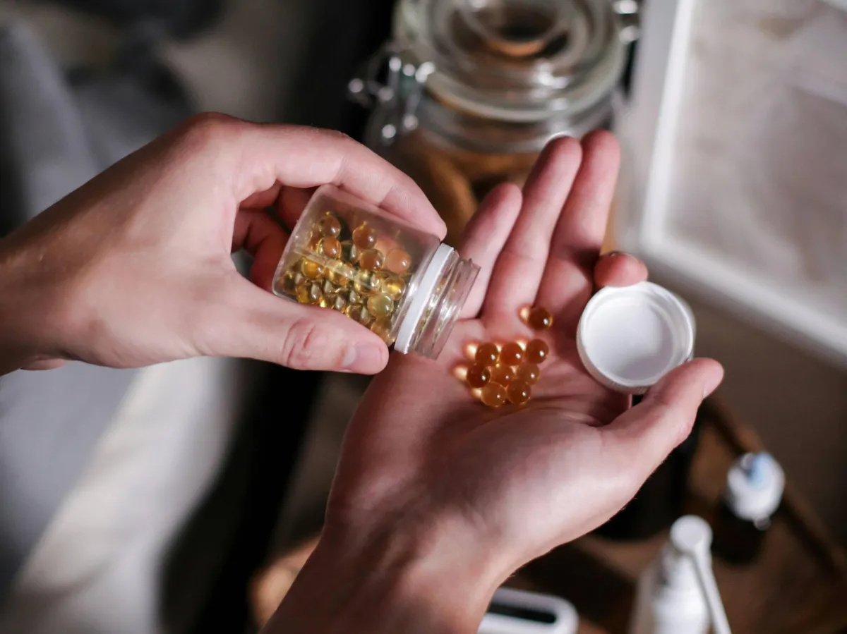 Patient holding a bottle of supplements